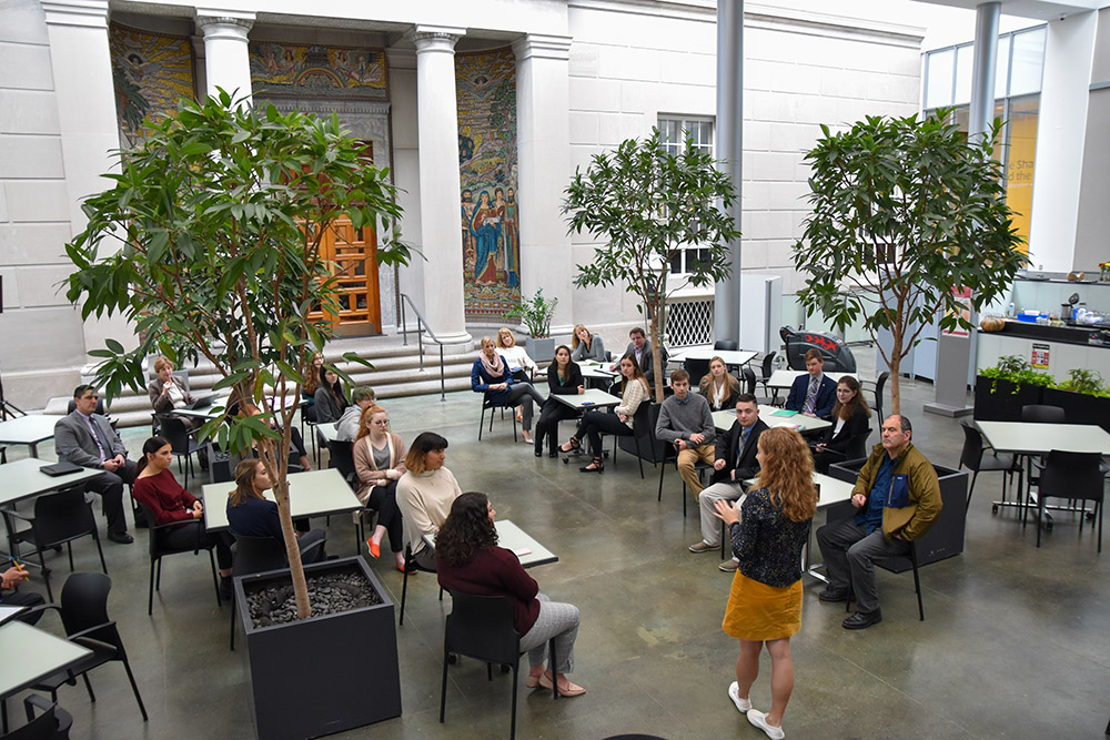 students in Currier Museum courtyard
