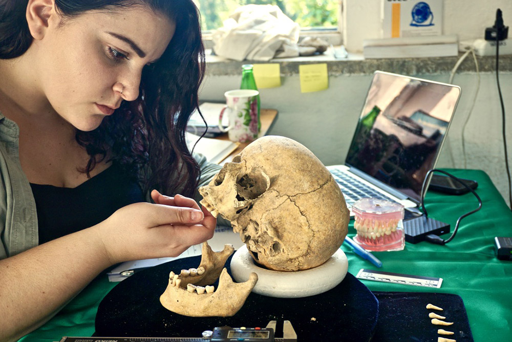 Katie examiining a skull