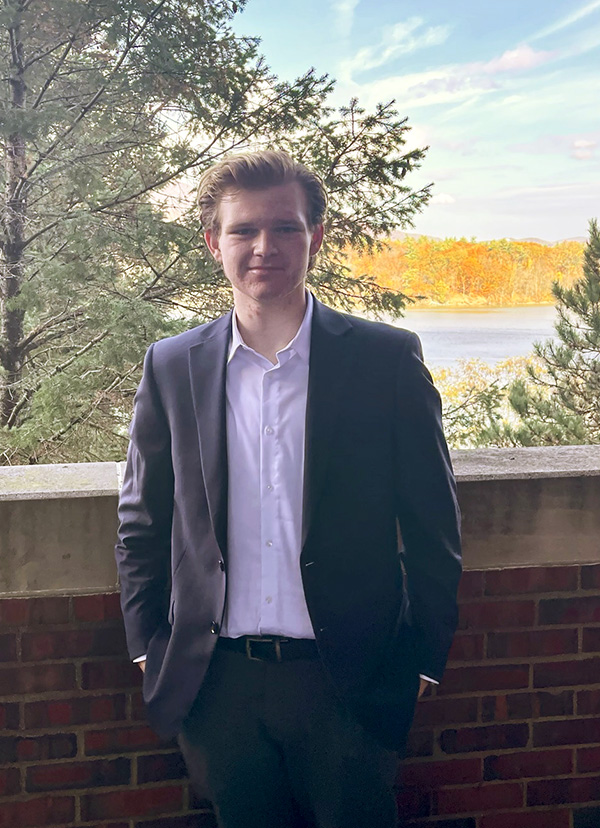 student in front of Hudson River