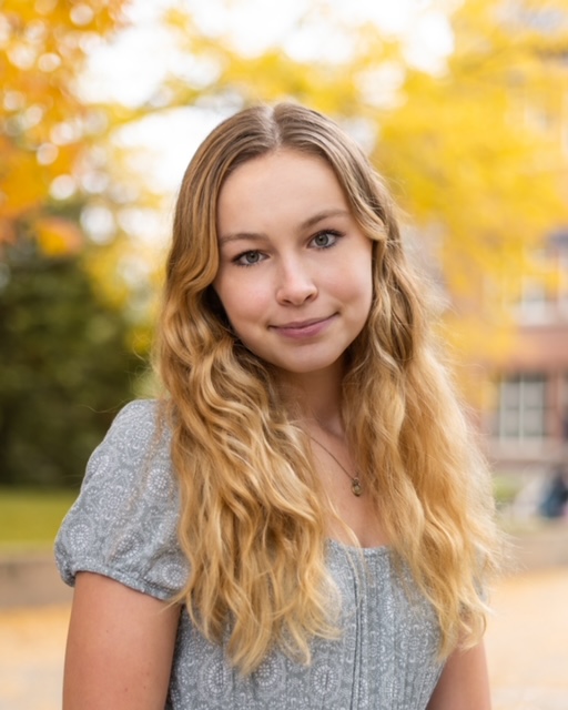 Portrait of young woman in autumn