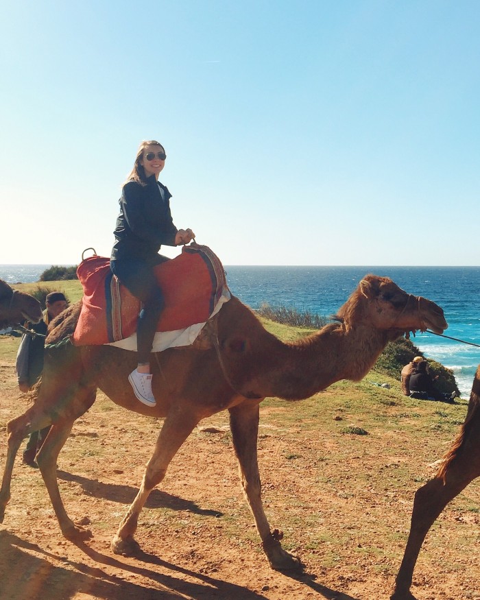 UNH student Charlotte Harris riding a camel in Morocco