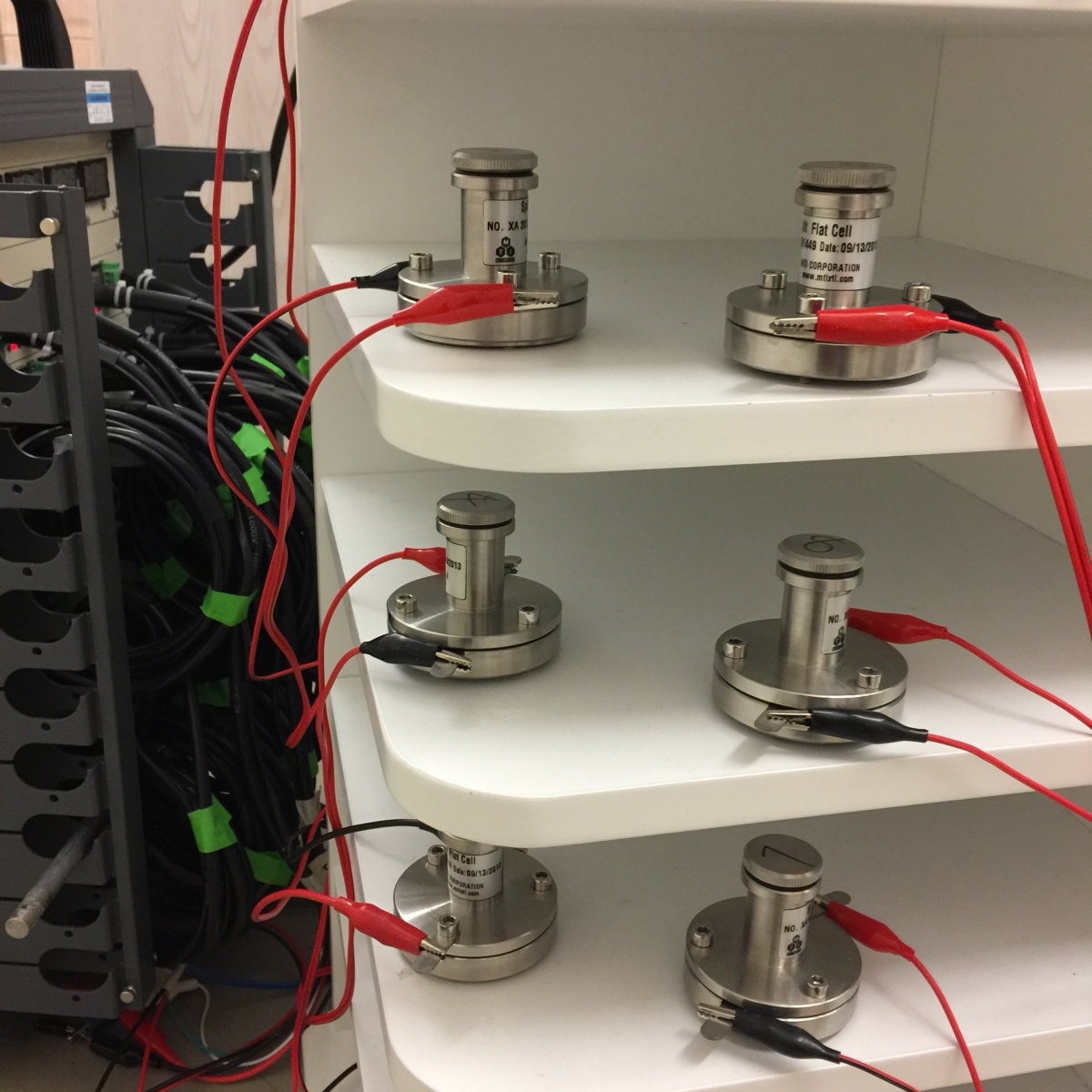 batteries on a shelf in a lab