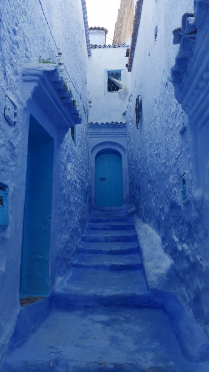 blue steps and a doorway in Chefchaouen, Morocco