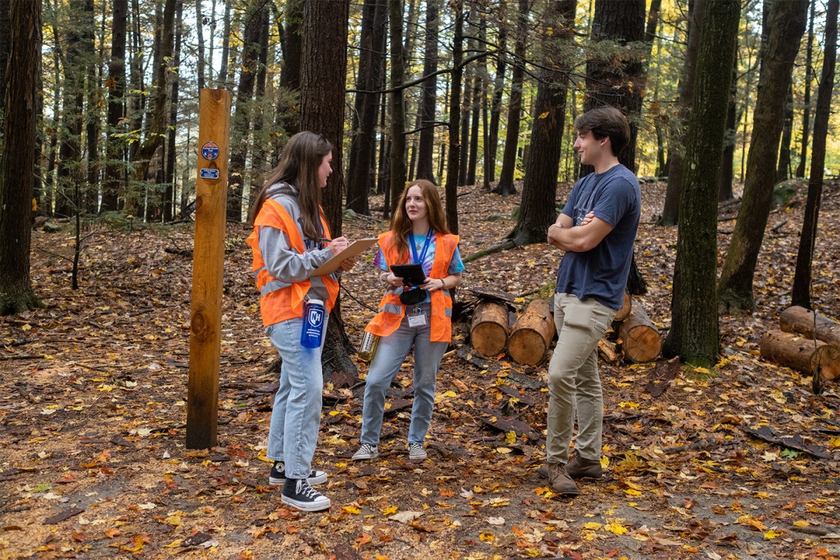Students practicing their surveying skills for a study of the link between biodiversity and health and wellness