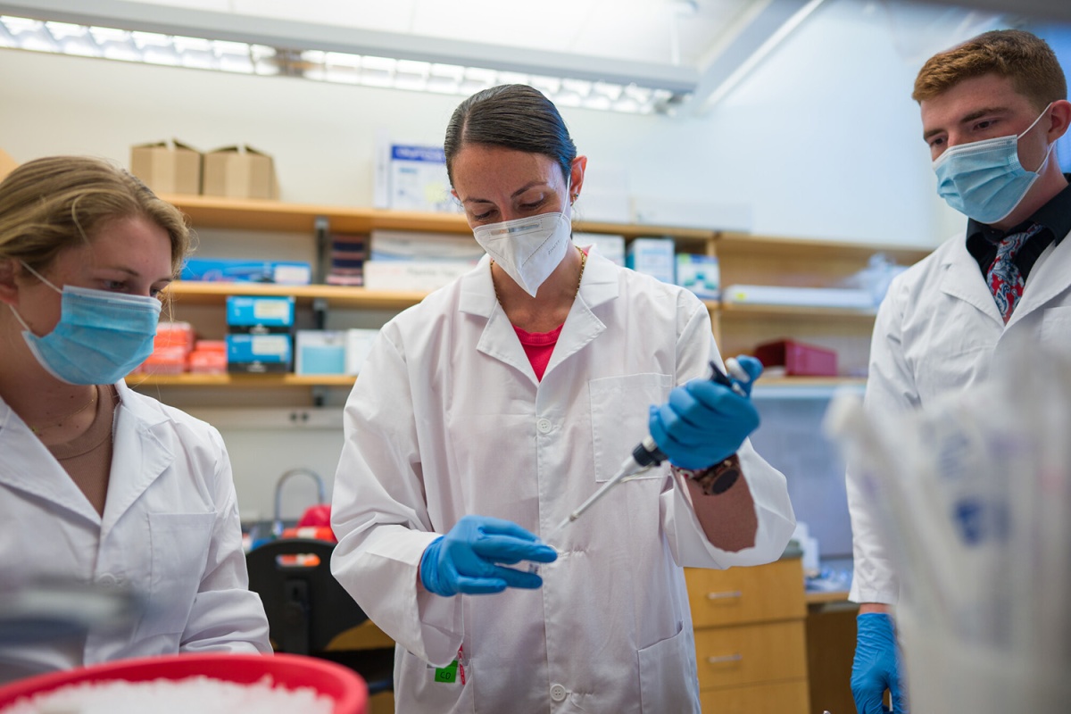 Research assistant and doctoral student Brandy Moser ‘23G, assistant professor Maria Carlota Dao, and undergraduate research assistant Jason Hansen ’22 work in Dao’s lab.