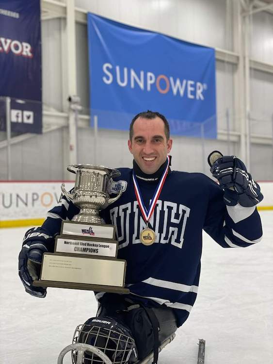 Temo Dadiani with sled hockey trophy
