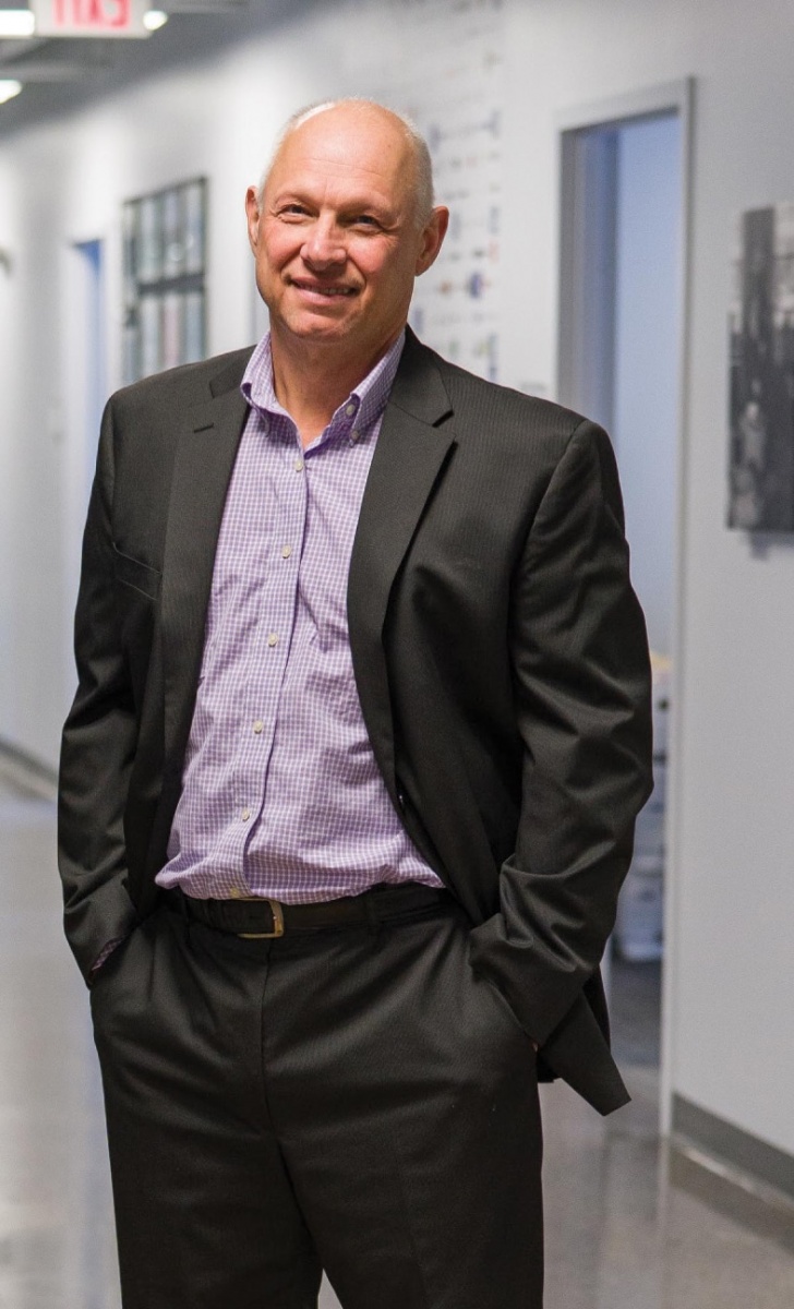 Portrait of man standing wearing suit coat