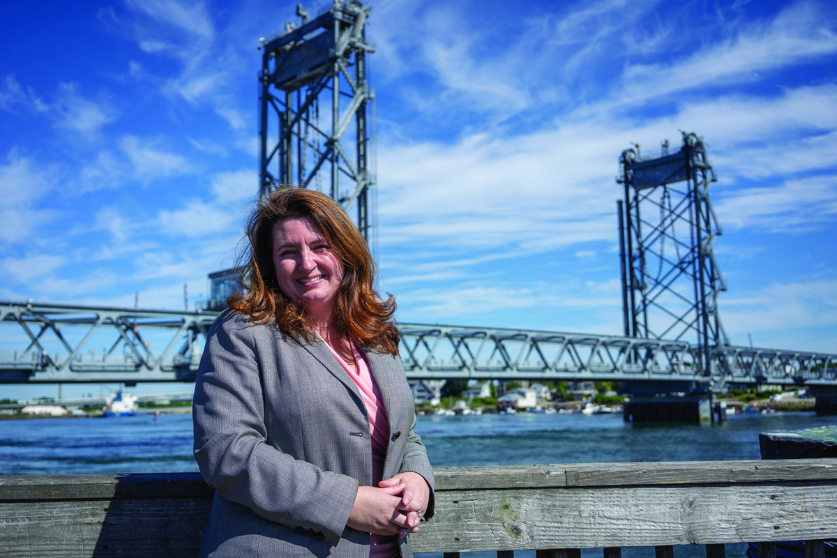 Erin Bell stands in front of Memorial Bridge