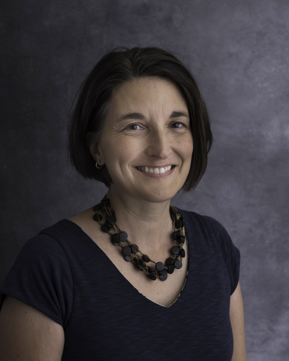 Headshot of researcher Serita Frey, wearing a dark t-shirt and necklace