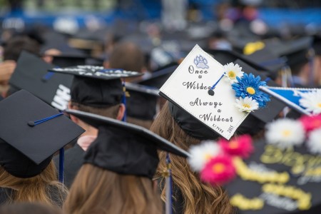 UNH students' mortarboards at commencement