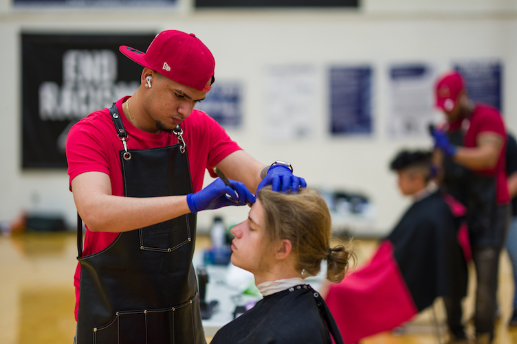 Student receiving a haircut