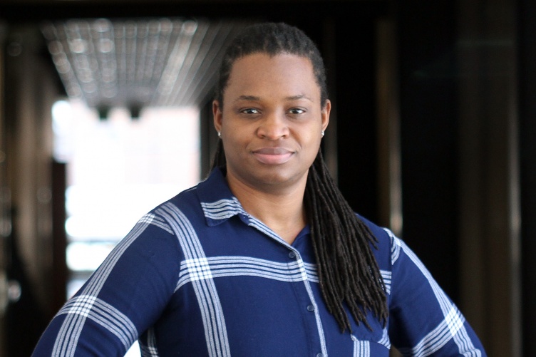 Portrait of Black woman in blue plaid shirt