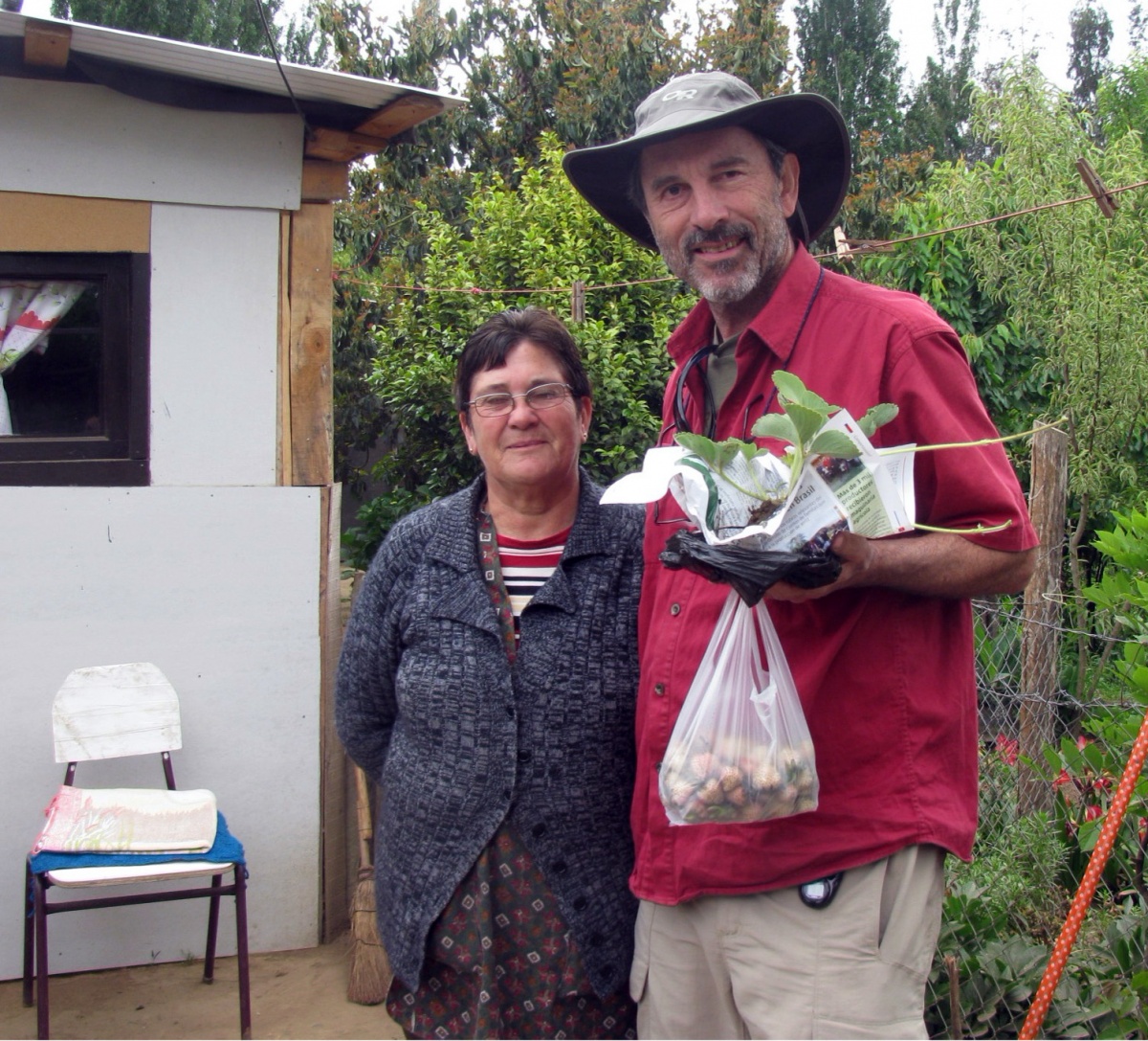 Tom Davis (man) with a strawberry farmer in Chile