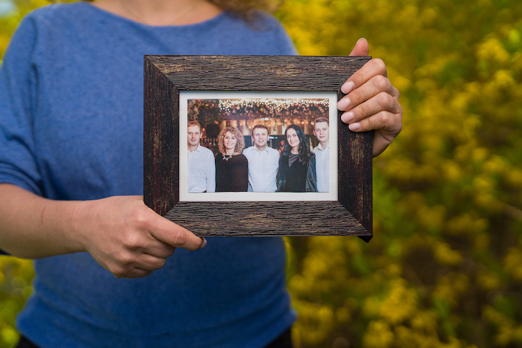 Babin holding family photo