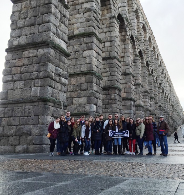 UNH Granada program students in front of an aqueduct in Segovia, Spain