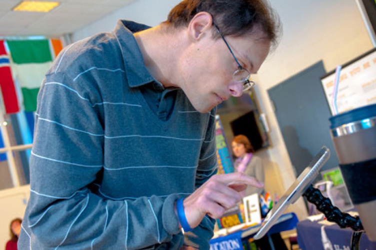 person with disabilities utilizing computer technology