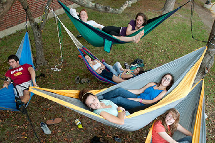 students relaxing in hammocks