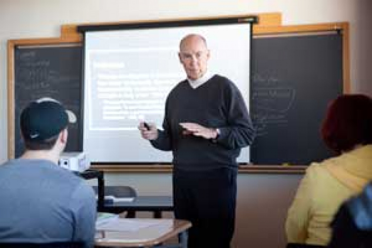 unh manchester history professor teaching a class