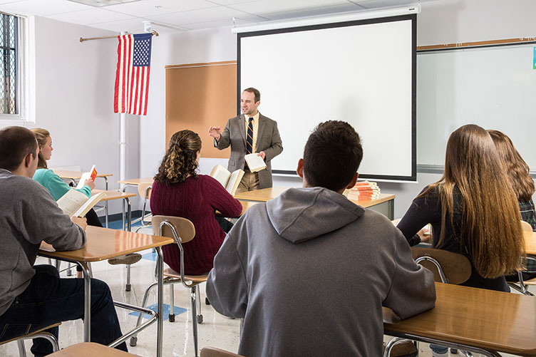 Laconia High School English teacher and UNH alumnus Tate Aldrich '08 in the classroom