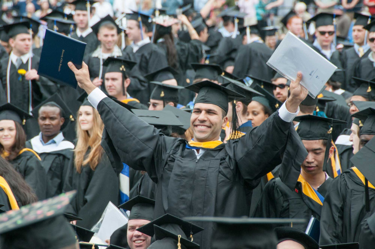 Members of the UNH Class of 2015 celebrate at their commencement