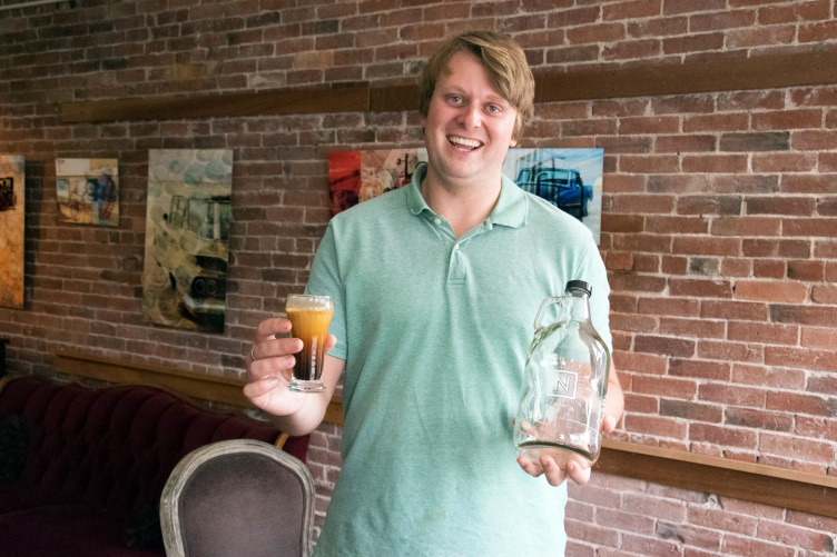 UNH graduate Connor Roelke in his nitro cold brew coffee shop