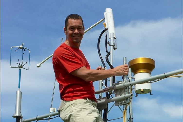 Researcher Scott Ollinger on a research tower