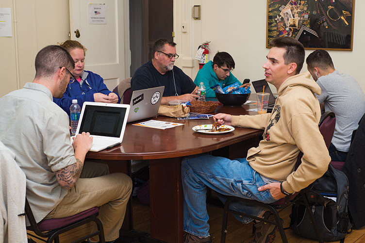 UNH veteran-students in the veteran-student lounge in Thompson Hall
