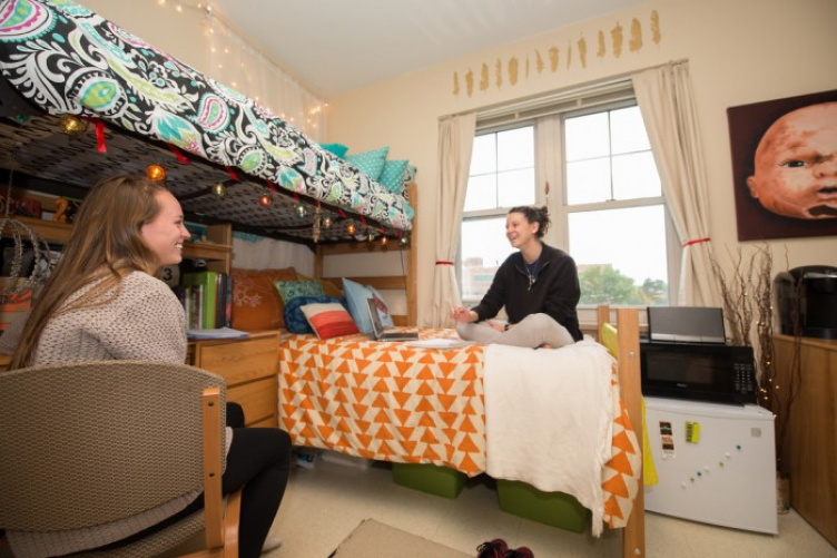 Two girls sitting in dorm room at UNH