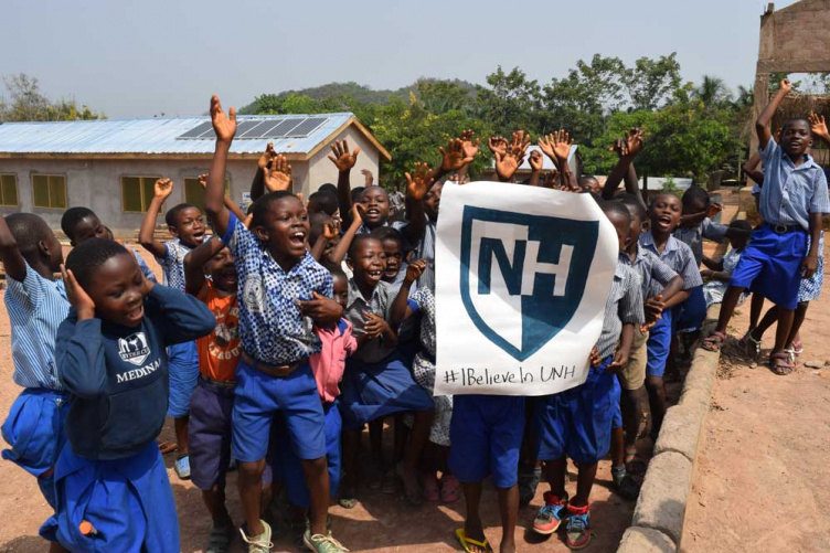 Students in Africa show their UNH pride