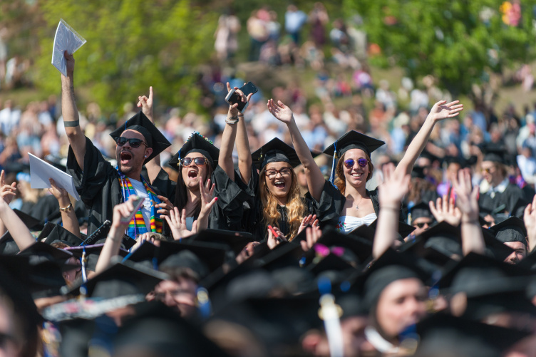 UNH students cheer at commencement.