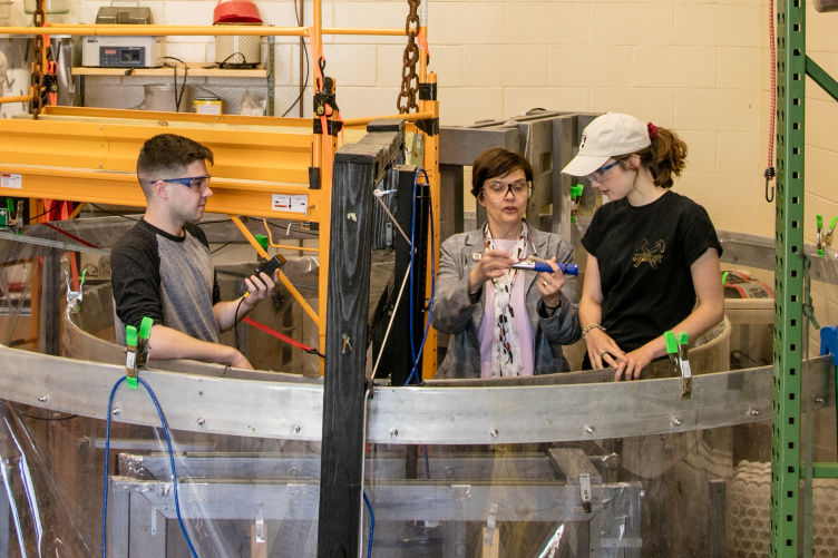 UNH Professor Nancy Kinner working with students. 