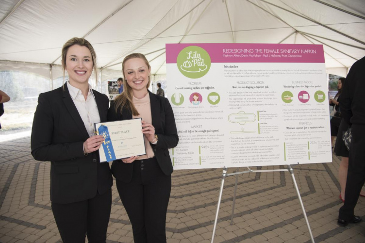 Kate Aiken (left) and Devin McMahon pose with their 2nd place prize and research poster for their 2016 Holloway Prize competition entry, LilyPad. UNH students Kate Aiken and Devin McMahon pose with their prize and research poster for the 2016 Holloway Prize competition entry, LilyPad.