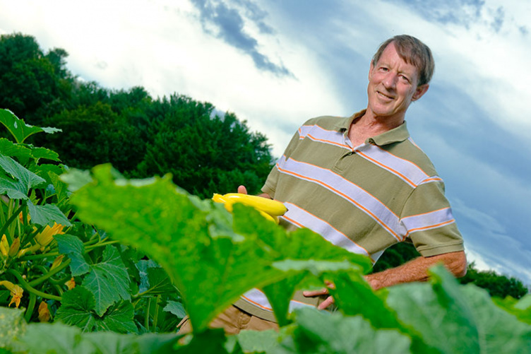 UNH professor emeritus J. Brent Loy with Slick Pik summer squash