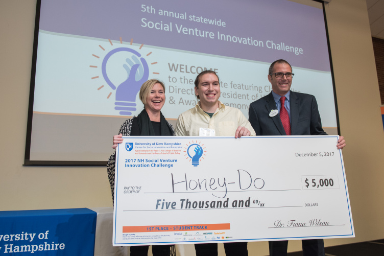 Andrew DeMeo, '18, student winner of the Social Venture Innovation Challenge, with presenters First-place student winner track Andrew DeMeo, '18 (center)