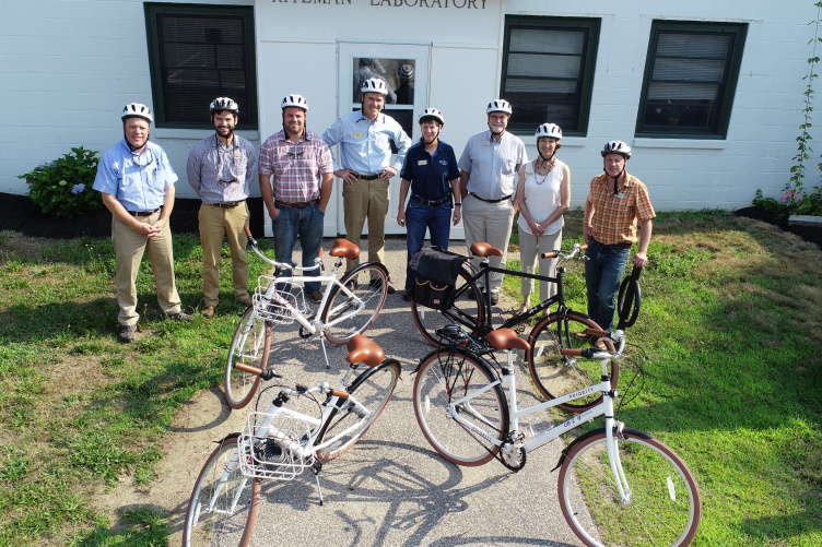 UNH facilities staff with bikes and helmets