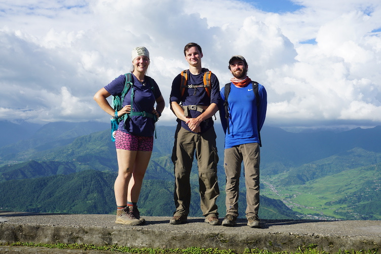 Students in Nepal with mountains in the background.