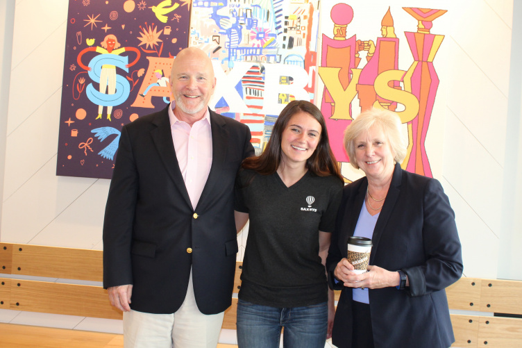 Crowe poses with Paul College hospitality management chair Nelson Barber and Dean Deborah Merrill-Sands at the Saxbys Durham grand opening
