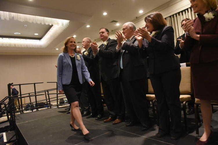 Mayor Craig walks past the three previous mayors of Manchester at her inauguration on January 2. 