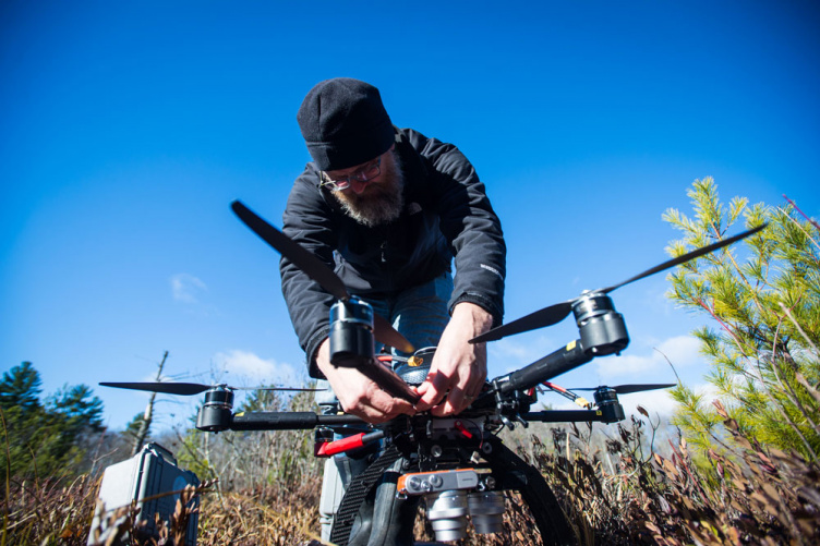 UNH's Michael Palace working on research in the field