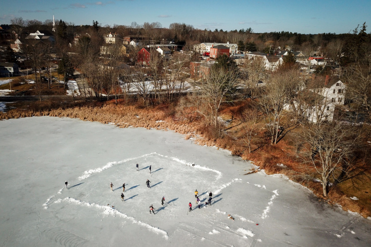 UNH students skating on the Mill Pond