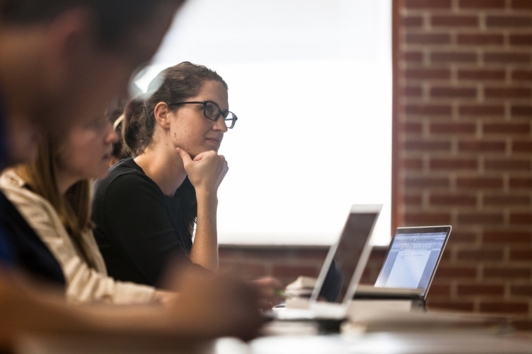 UNH law Student working on laptop