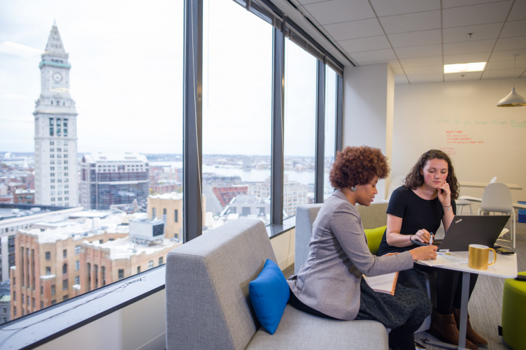 Students working in an office in the city