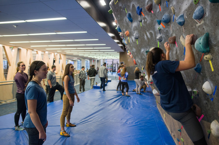 UNH students at the campus bouldering wall