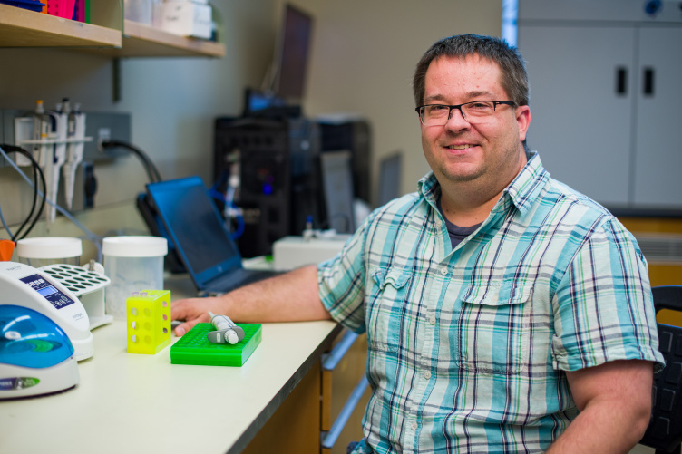 Matt MacManes, assistant professor of genome-enabled biology Researcher Matt MacManes seated in his lab