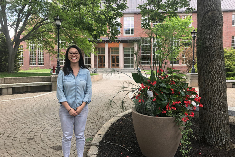 photo of Sasa Tang in front of Library