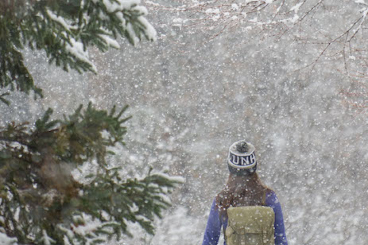 student walking in the snow