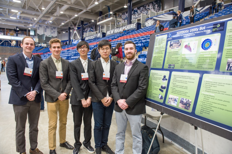 Five CEPS students standing beside a poster at URC