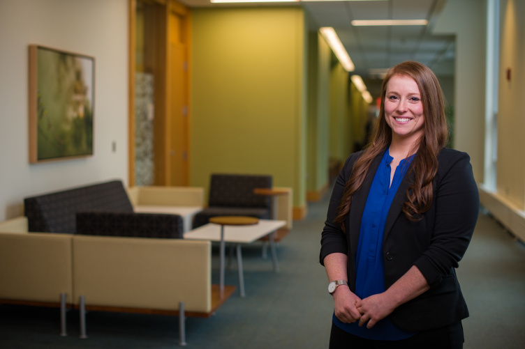 Assistant Professor of Organizational Behavior and Management Jennifer Griffith standing in a hallway of Paul College