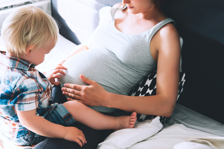 pregnant mother with child