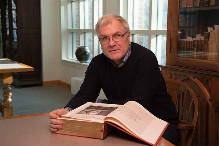 photo of Douglas Lanier with Shakespeare Folio
